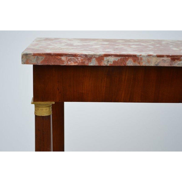 Antique Italian Classical Mahogany Marble Top Console Table circa 1820 (19th Century). This side table has gilt bronze mounts, a laminated marble top, and bears the label of the apparent maker in Florence Italy.